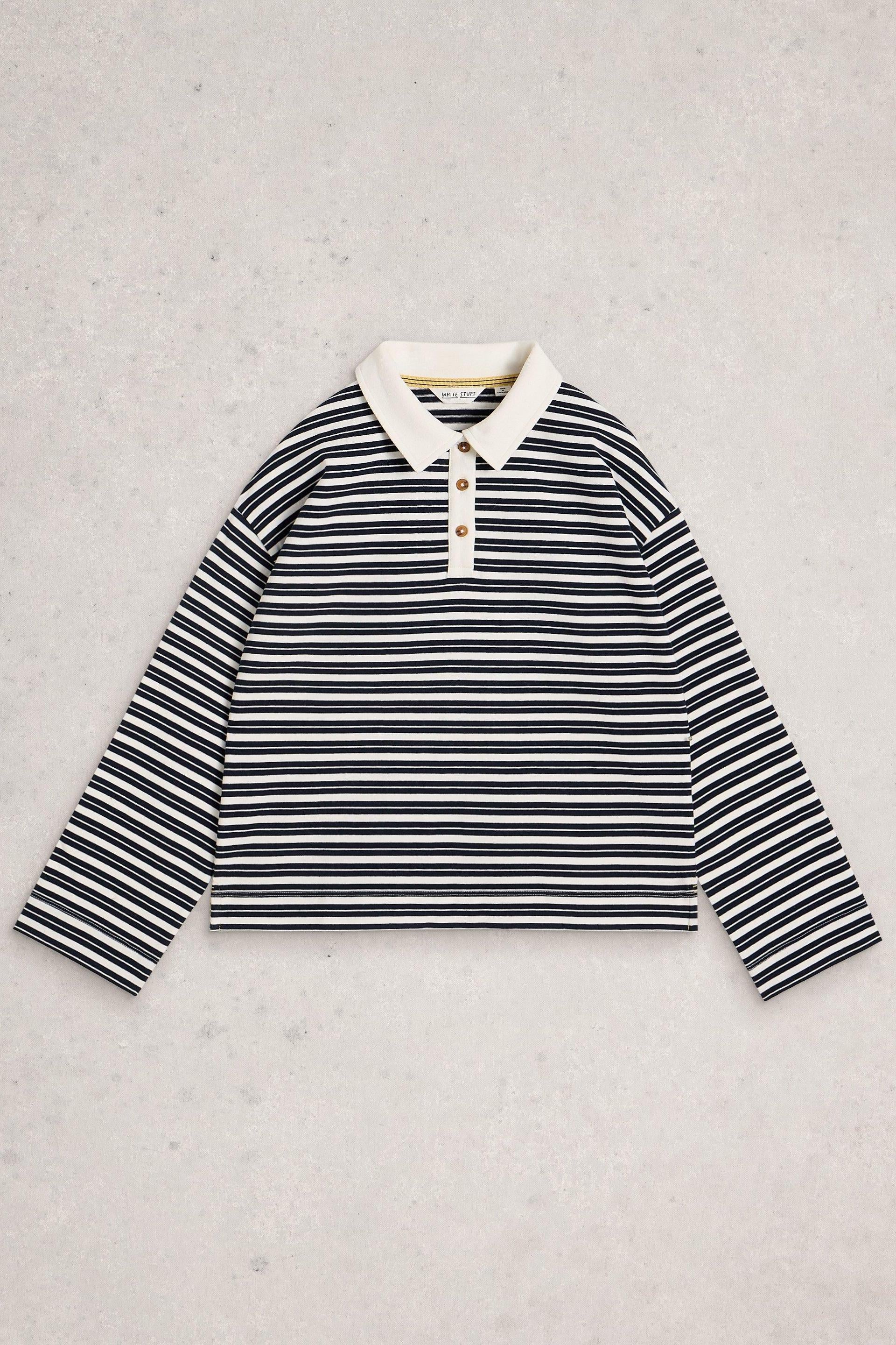 A White Stuff long-sleeved women's striped rugby top featuring a cream collar and organic cotton fabric.