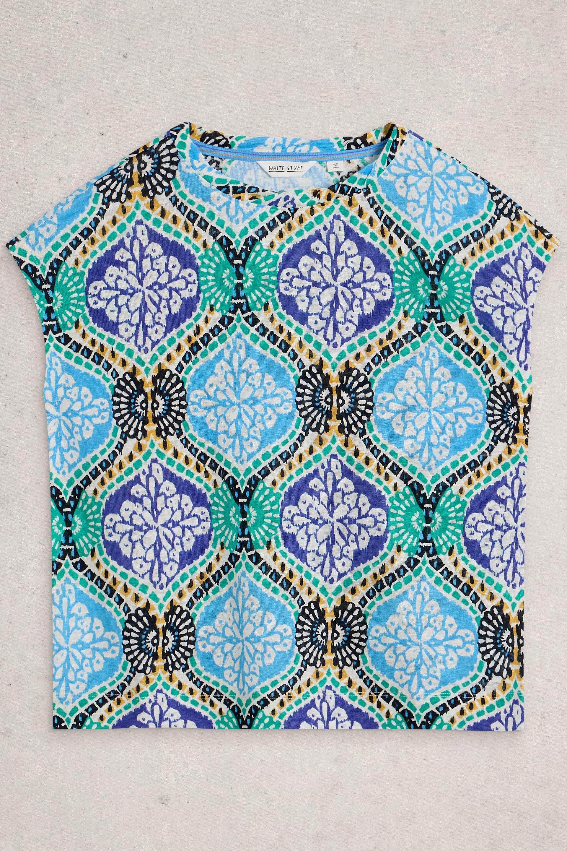 Colourful geometric patterned top on a light gray background