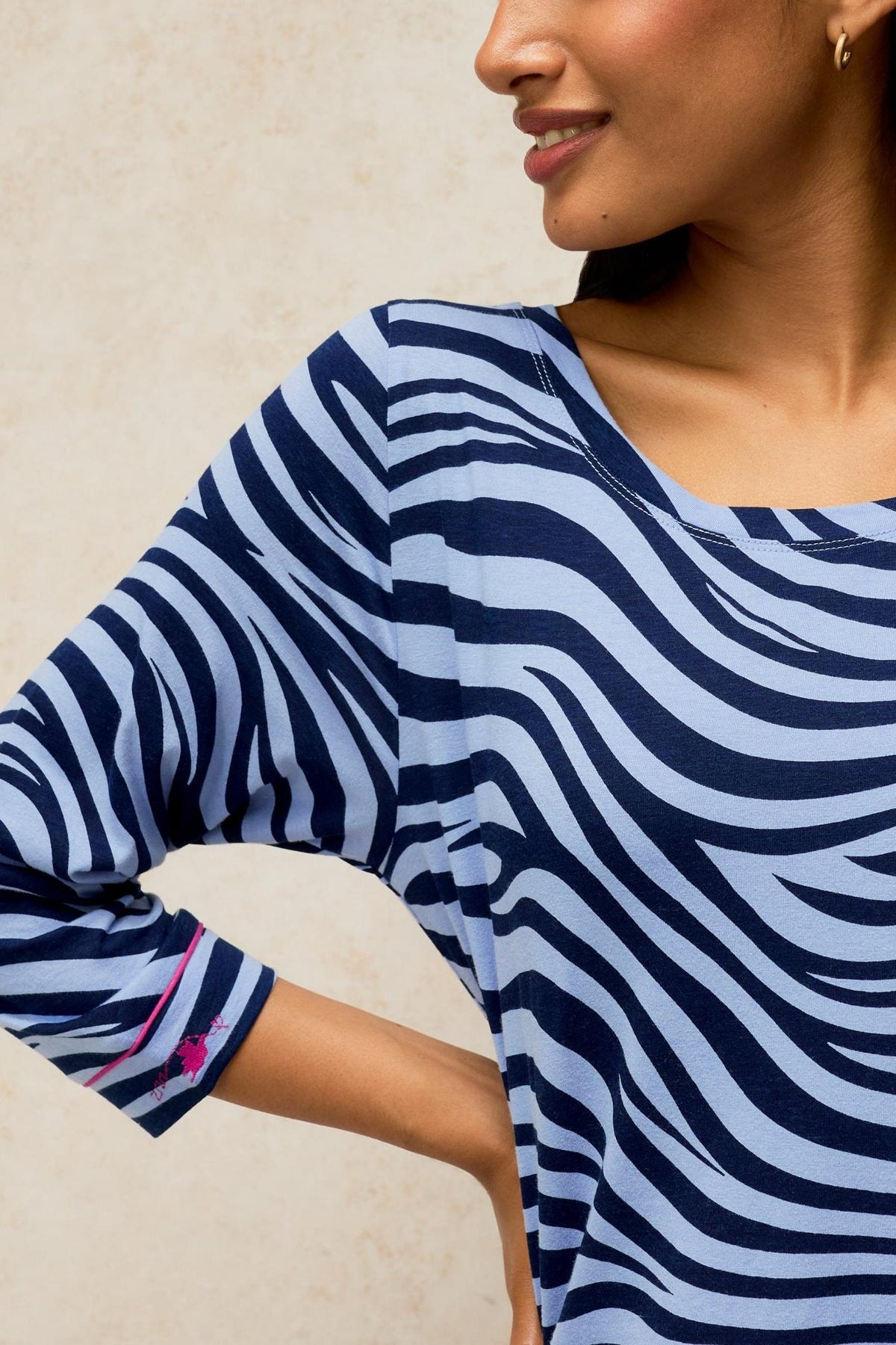 Woman smiling in a blue zebra print White Stuff organic cotton night shirt