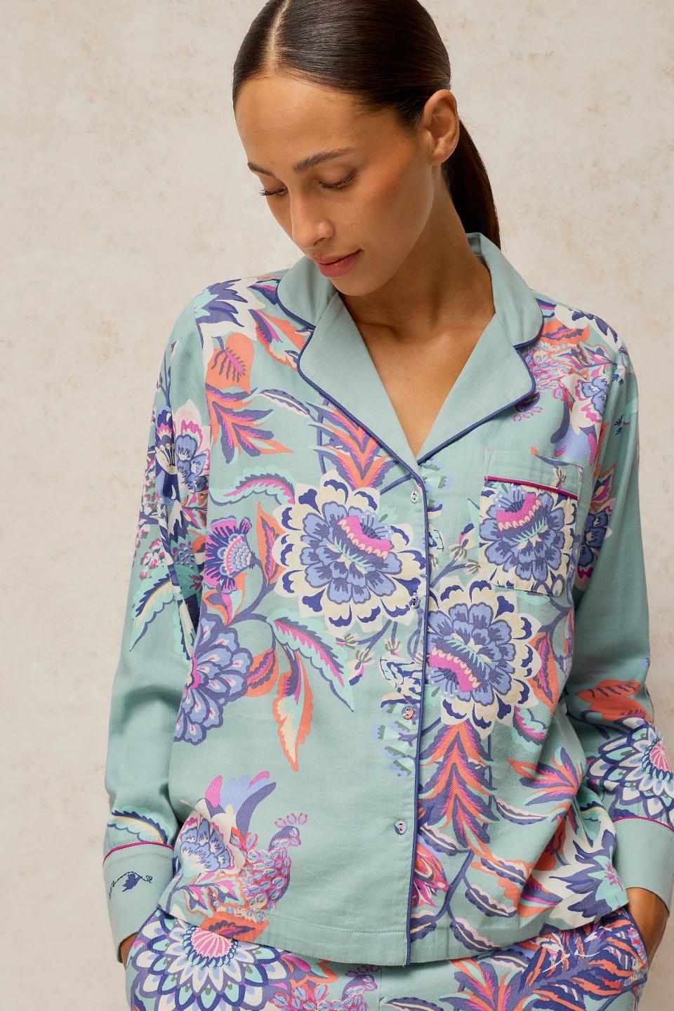 Woman wearing a blue floral organic cotton White Stuff pyjama top