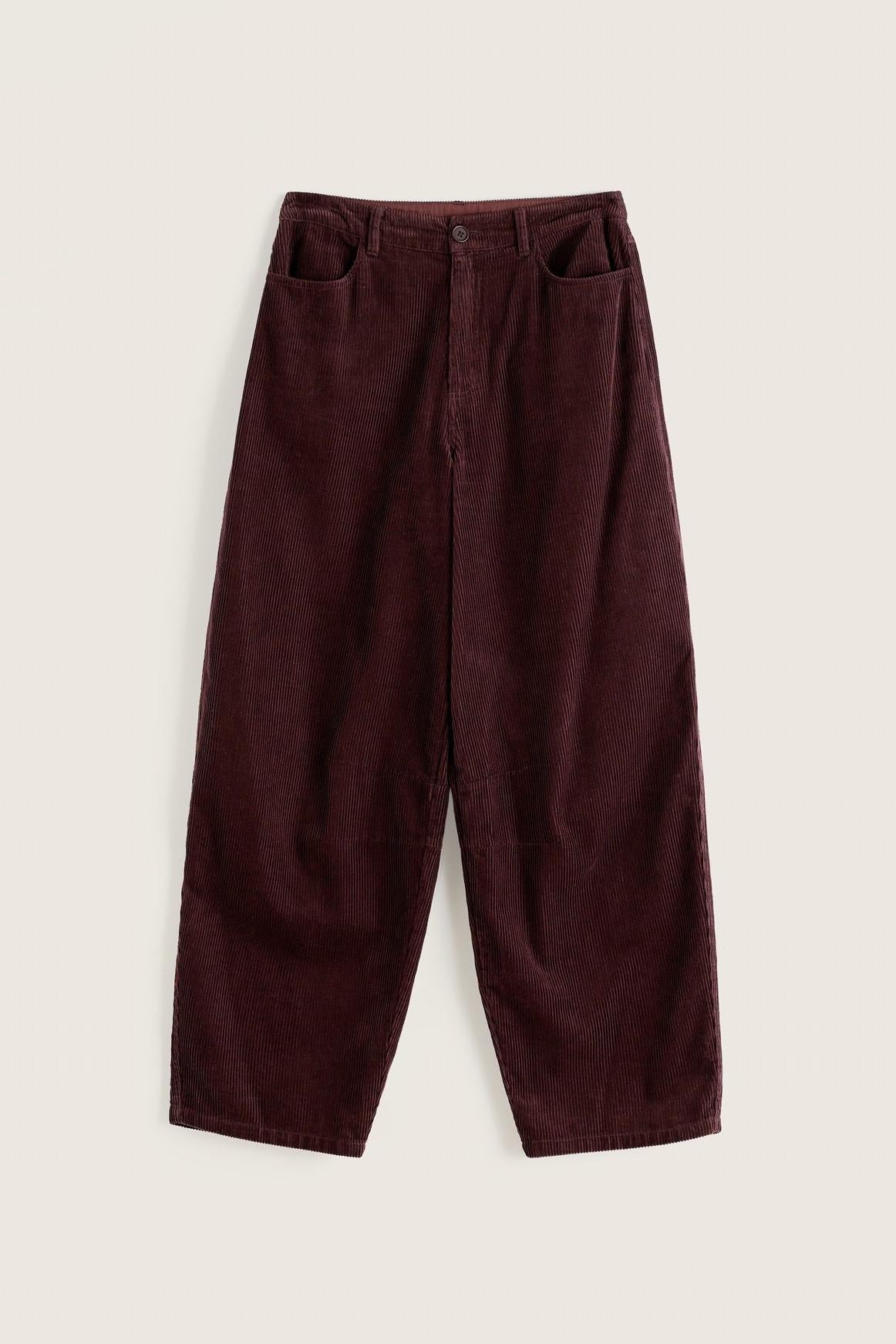 Seasalt Cornwall brown corduroy barrel leg trousers for women isolated on a plain background.