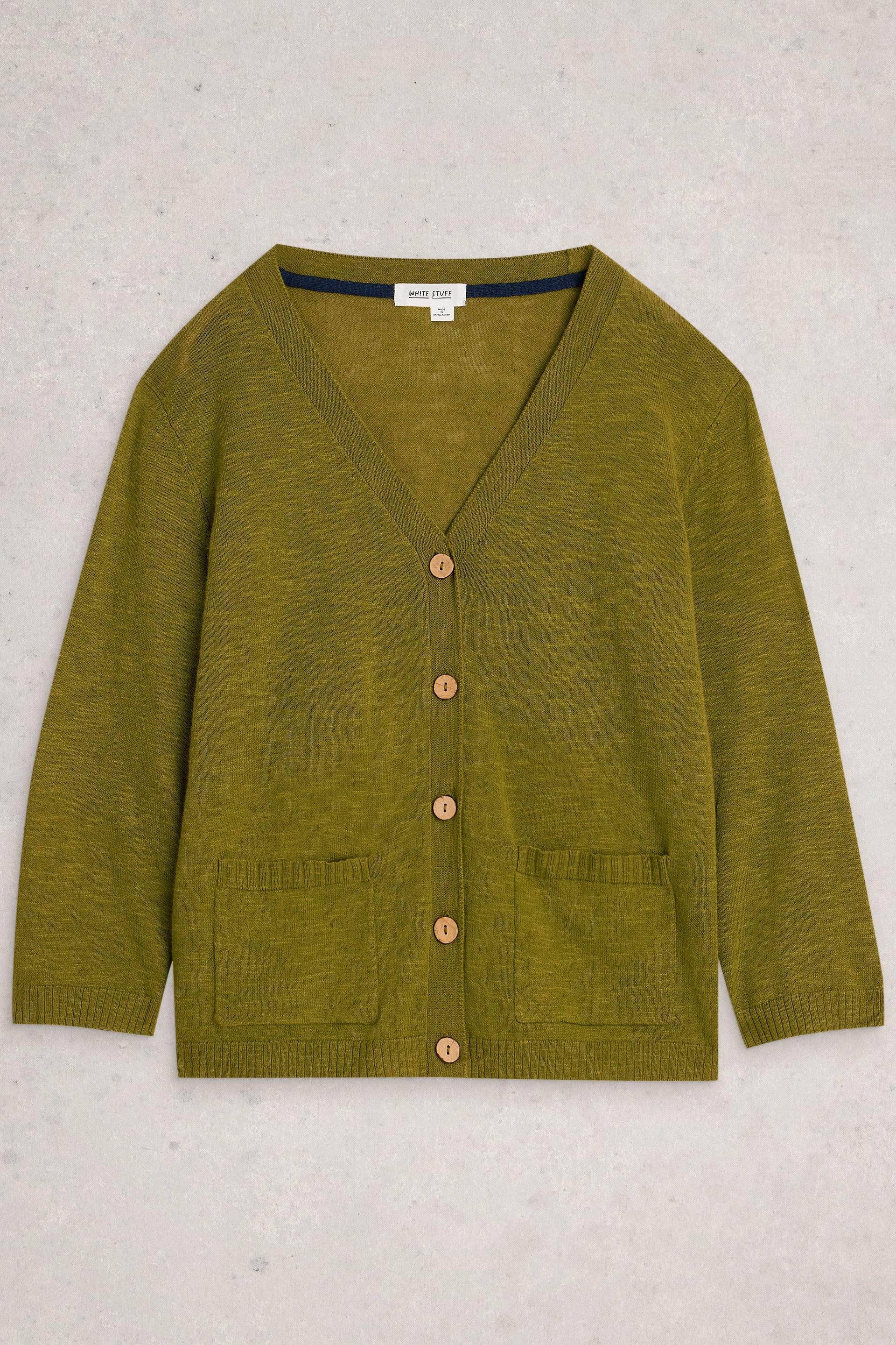 Green White Stuff cardigan with buttons on a light gray background