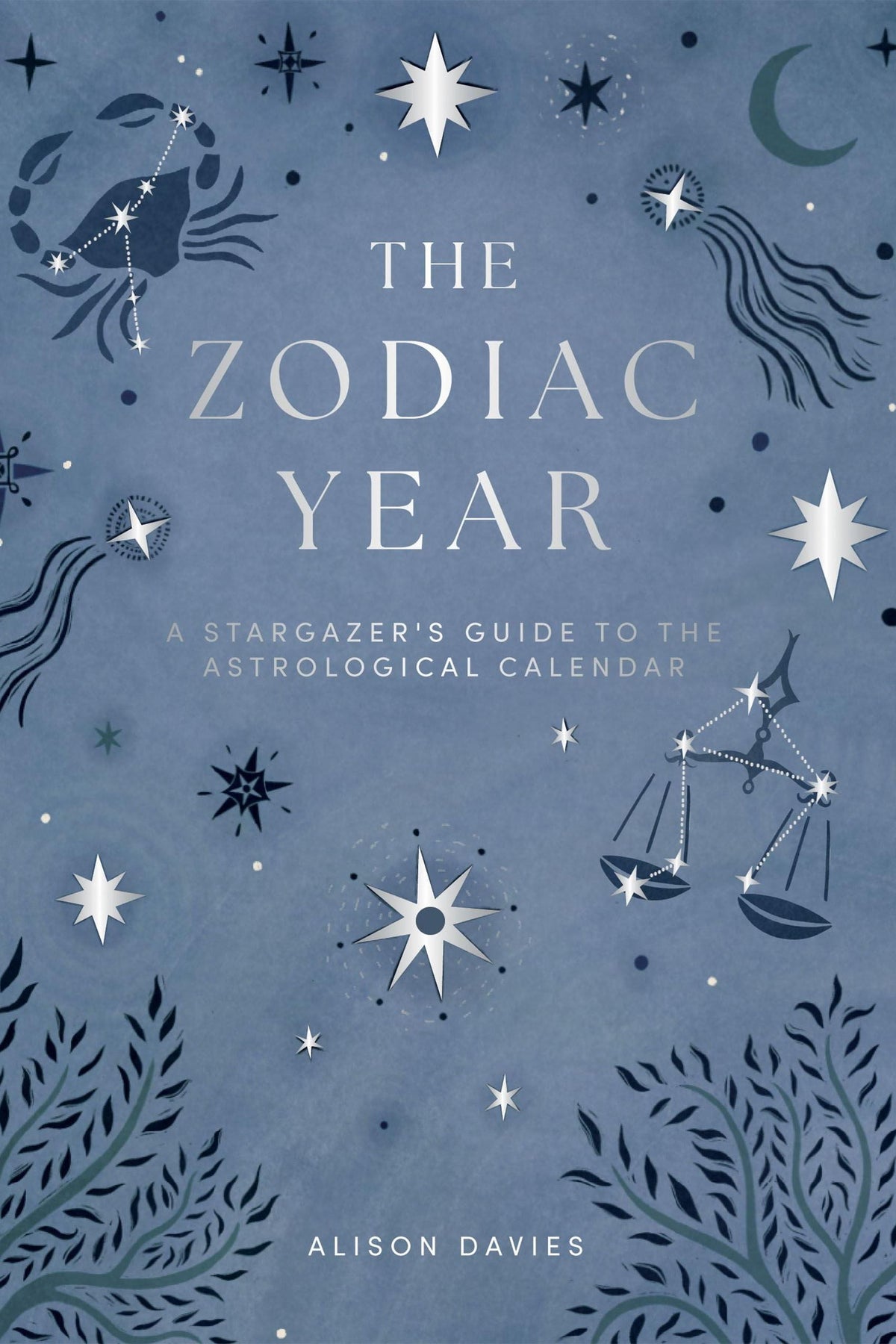 Front cover of The Zodiac Year, an astrology book with silver stars and zodiac constellations on a blue background.