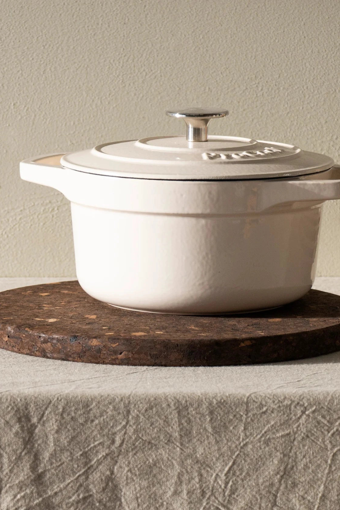 The Liga Smoked Cork Trivet in use, placed under a hot pot to protect surfaces.